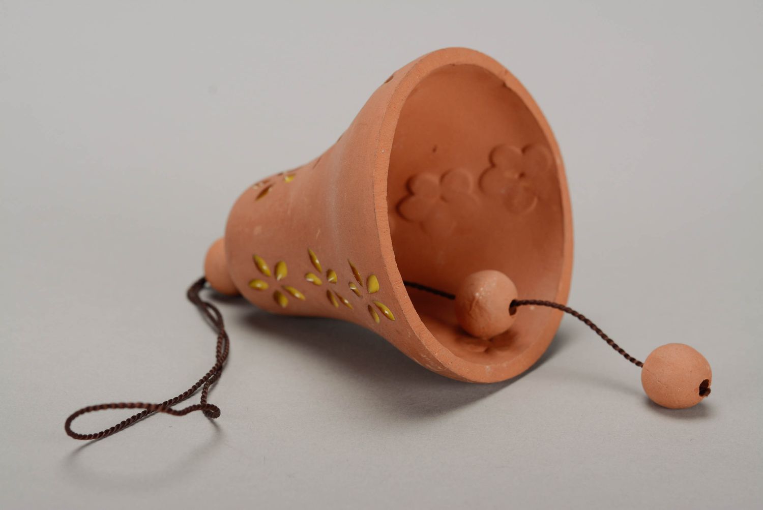 Bell made from red clay photo 1