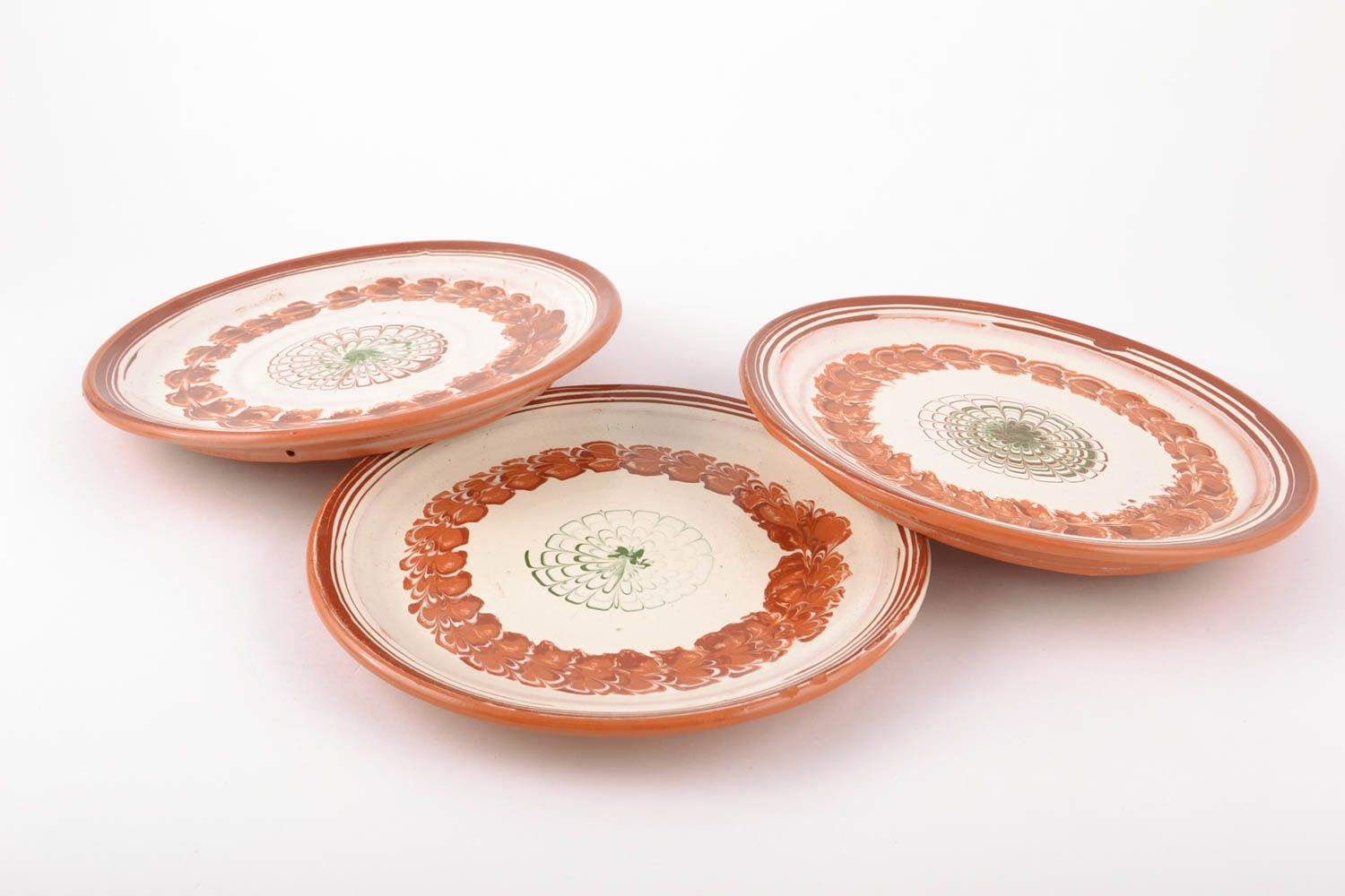 Set of ceramic plates made using flyandrovka technique photo 3