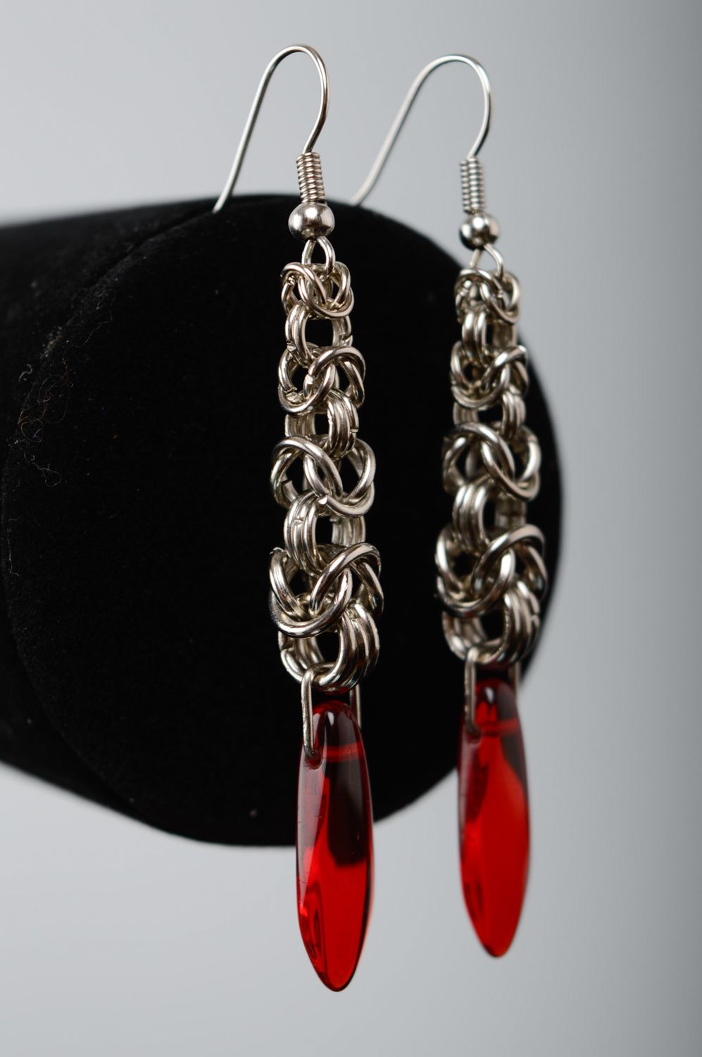 Long metal earrings with red beads made using chain armor weaving technique photo 1
