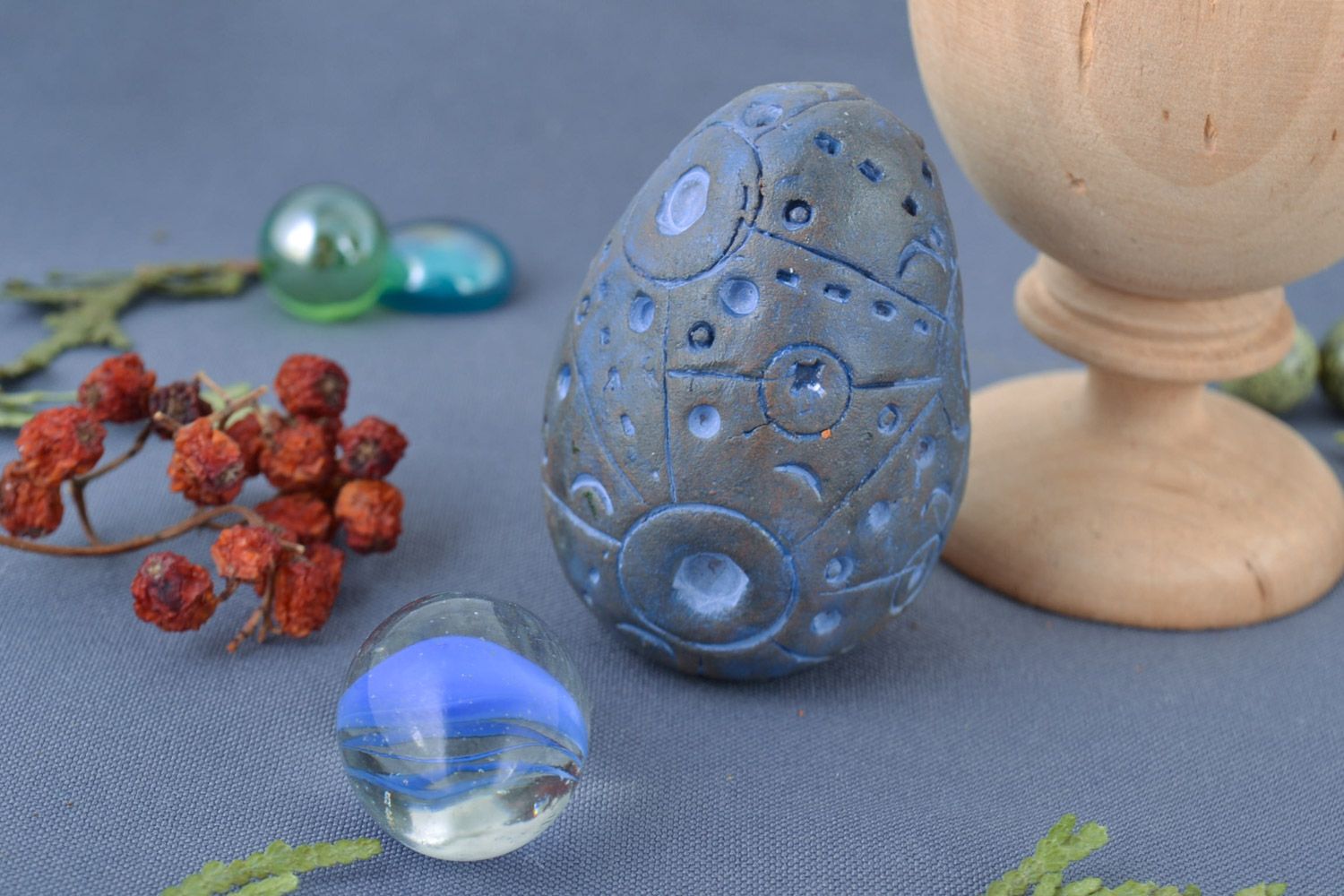 Handmade decorative ceramic egg painted with blue acrylics for interior decor photo 1