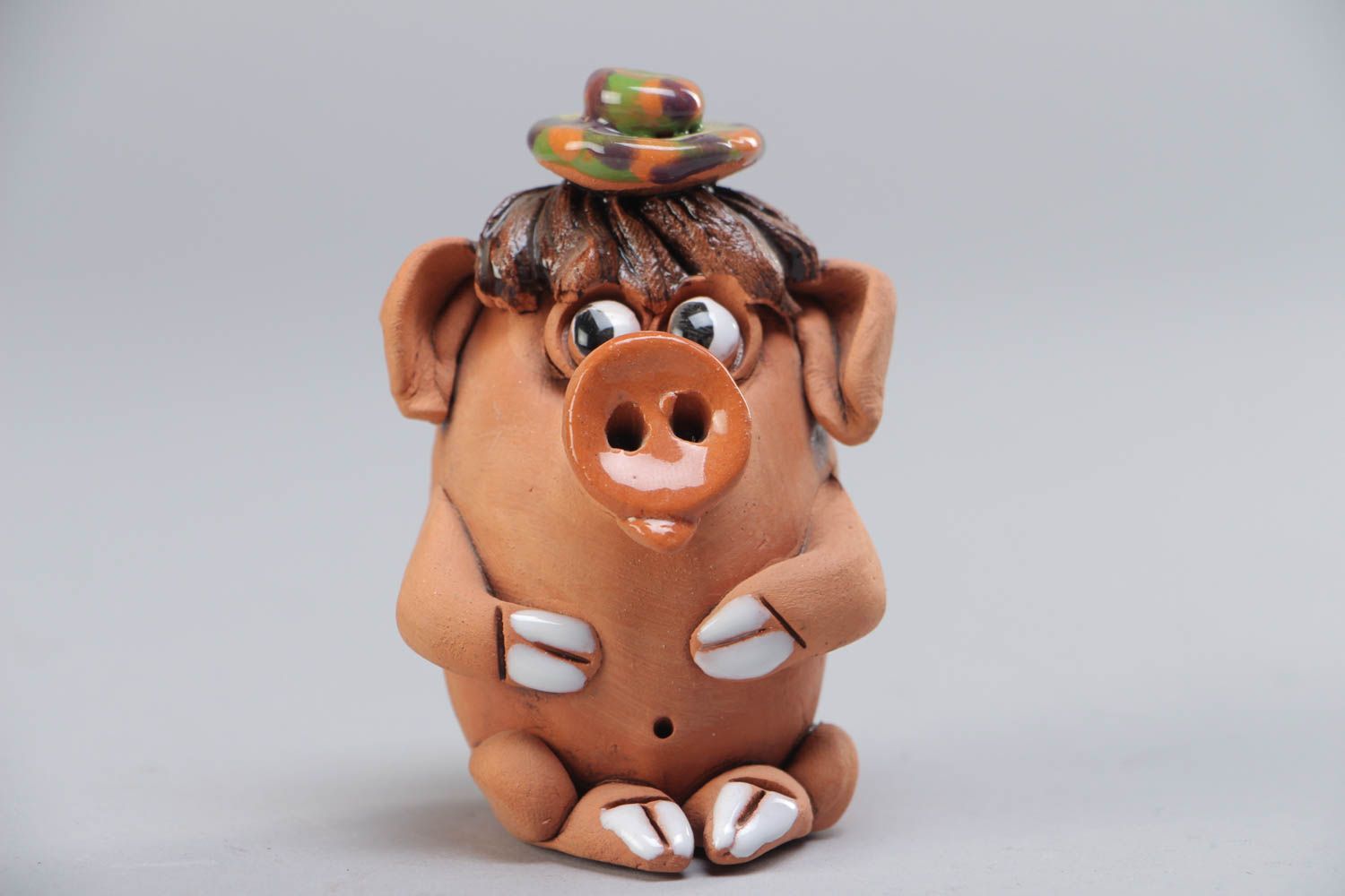 Small handmade ceramic figurine in the shape of funny pig for interior decoration photo 2