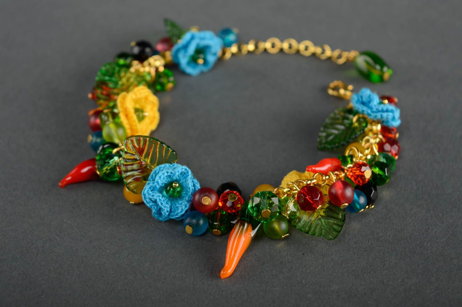 Bright beautiful crochet bracelet with charms and flowers photo 1