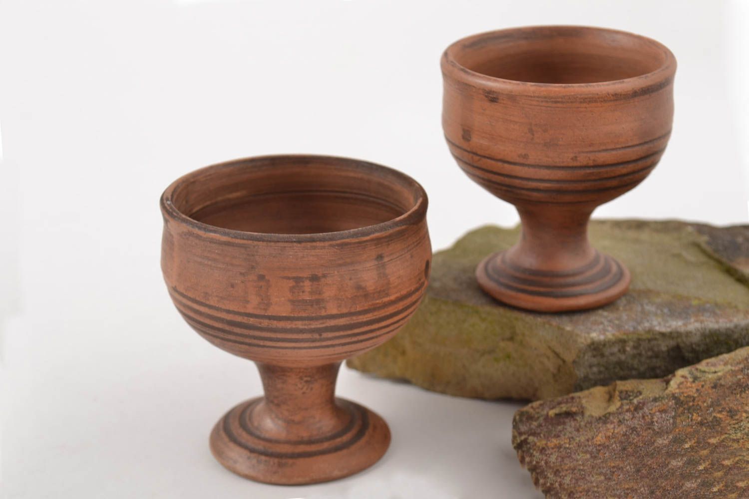 Set of 2 two red clay shot cups on legs with no pattern photo 1