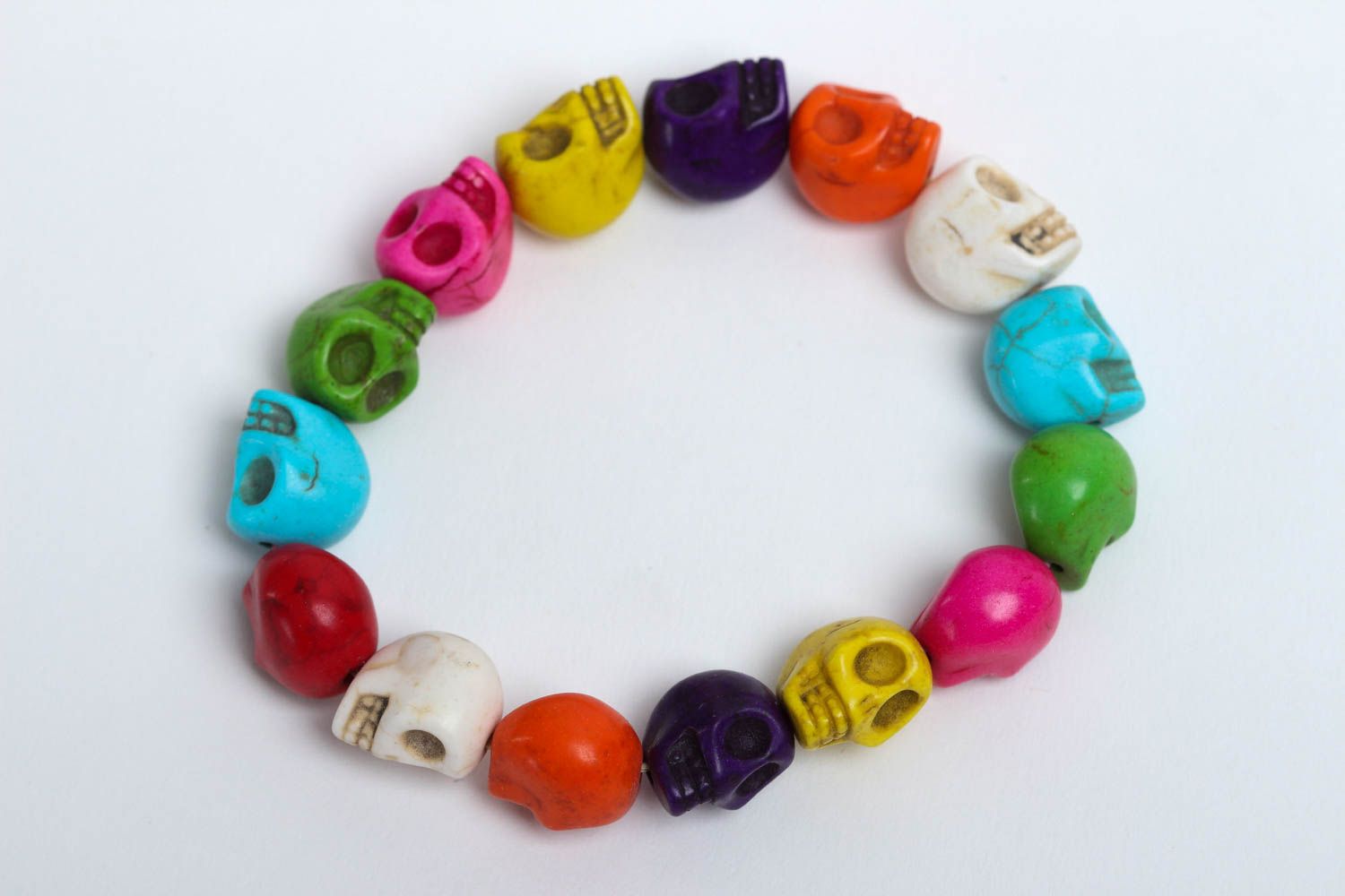 Multicolored skull beads bracelet on an elastic string photo 2