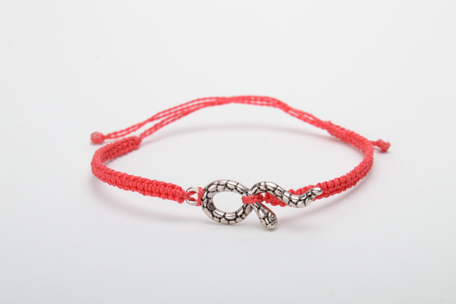 Handmade designer women's macrame bracelet of red color with metal snake charm photo 5