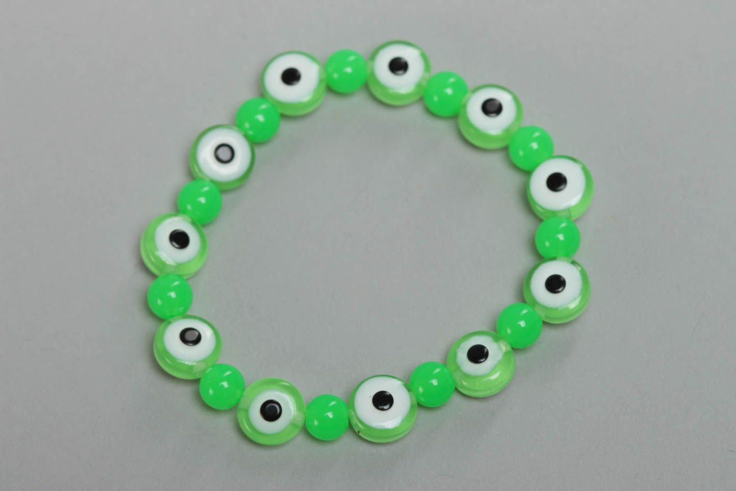 Nice green handmade children's wrist bracelet with resin and plastic beads photo 2