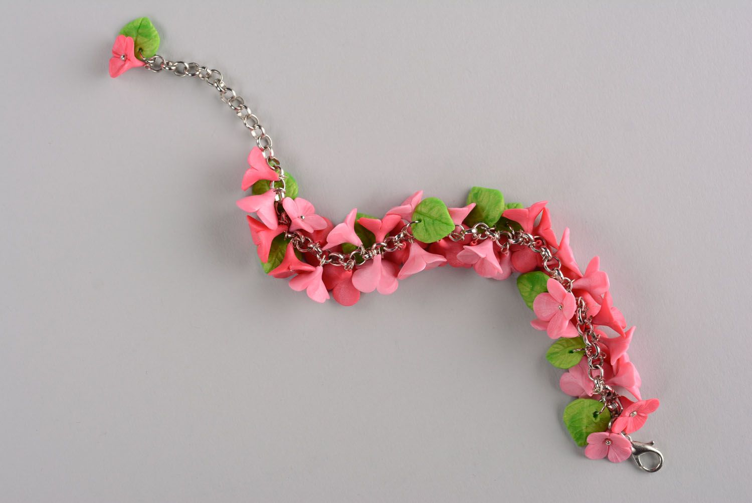 Charm pink field flowers' bracelet with green leafs photo 2