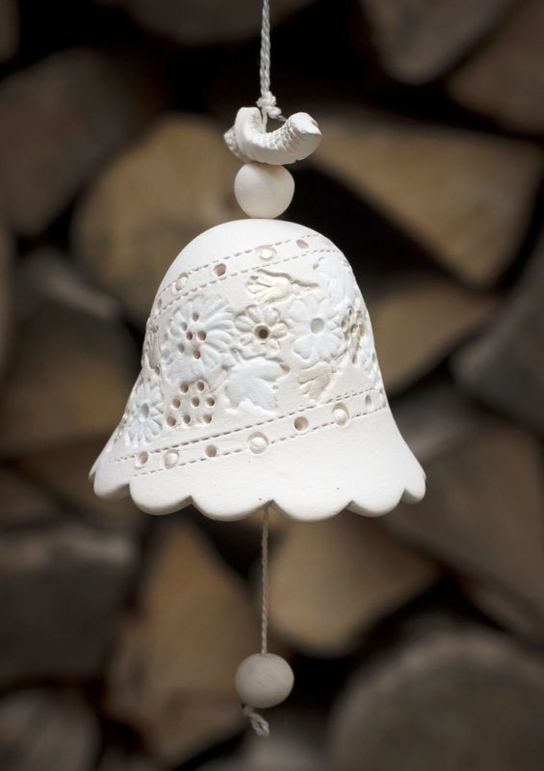 Hanging bell made from white clay photo 1