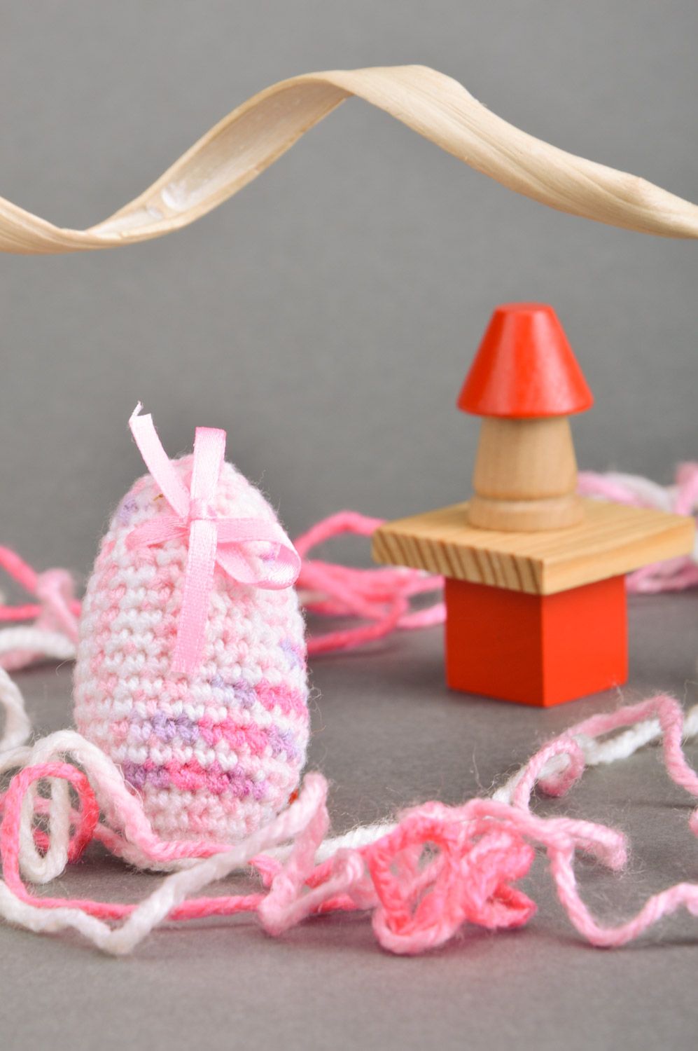 Handmade decorative soft Easter egg crocheted of pink threads with bow photo 1