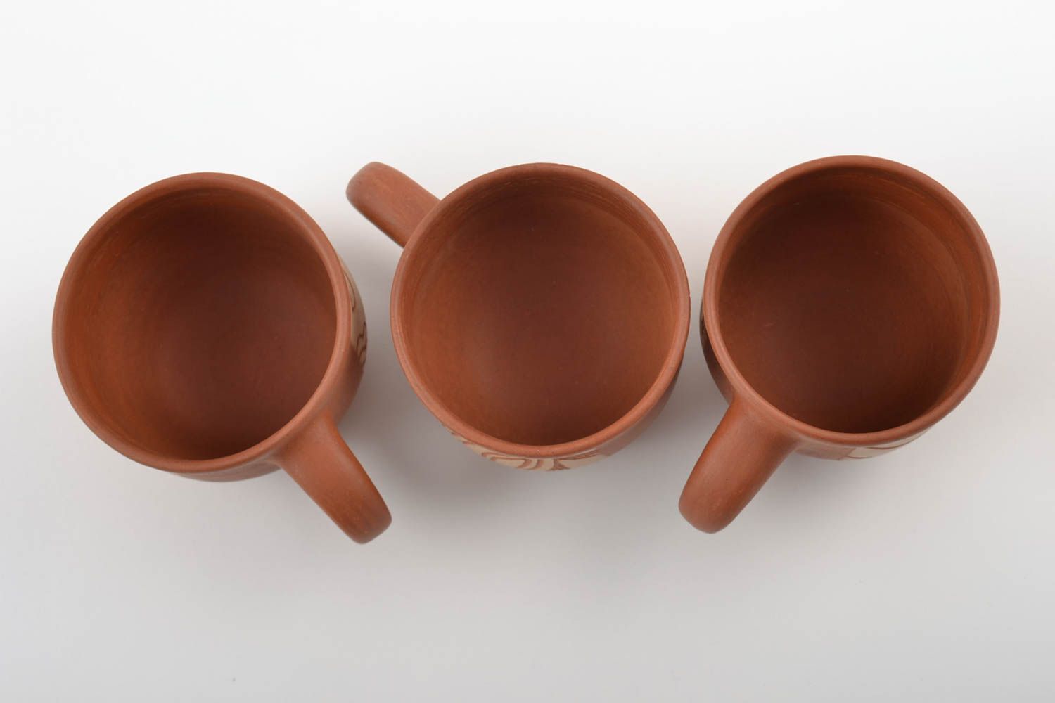 Set of 3 three ceramic cups with cave drawings in terracotta style photo 4