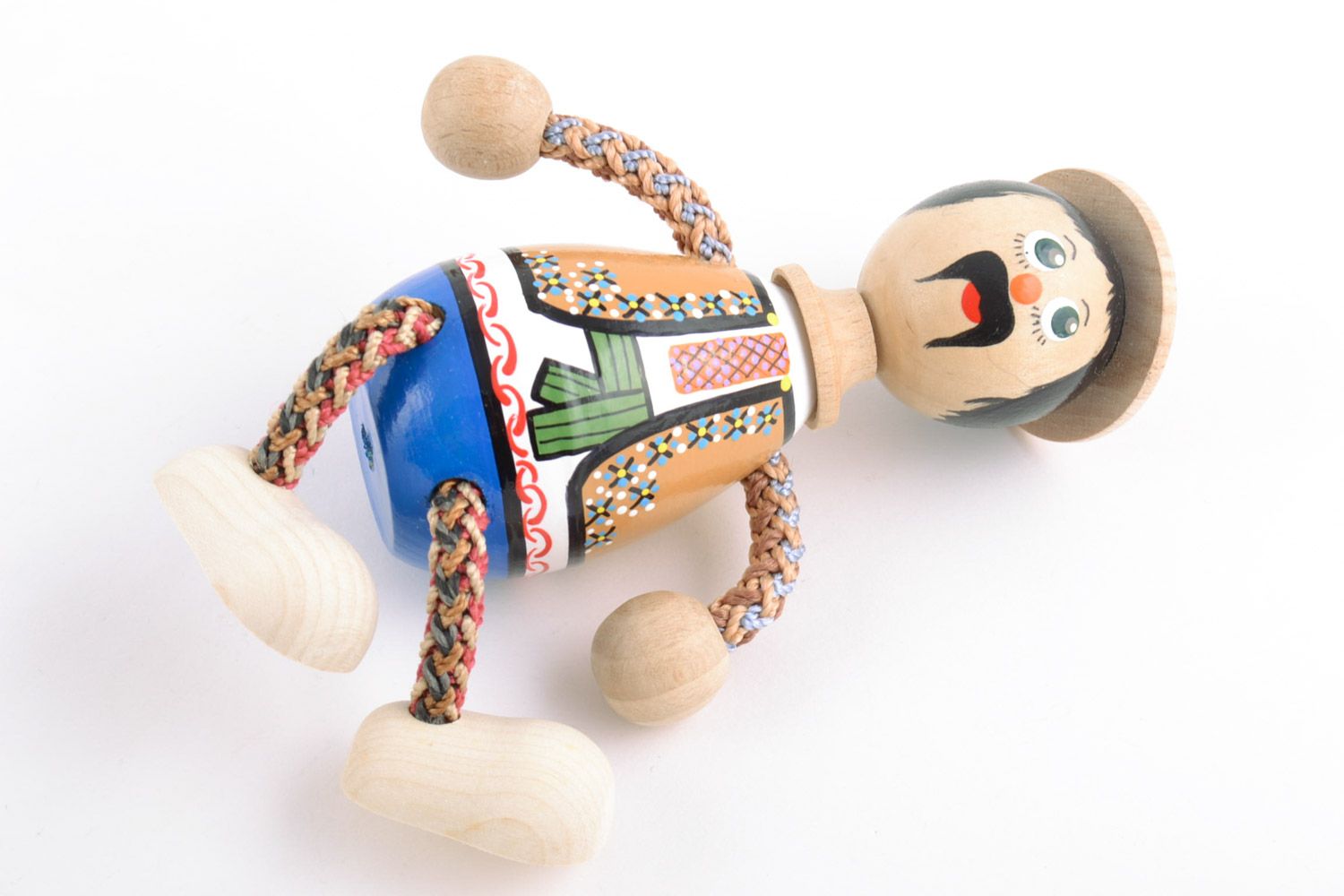 Handmade painted wooden eco toy in the shape of boy in national Ukrainian costume photo 5