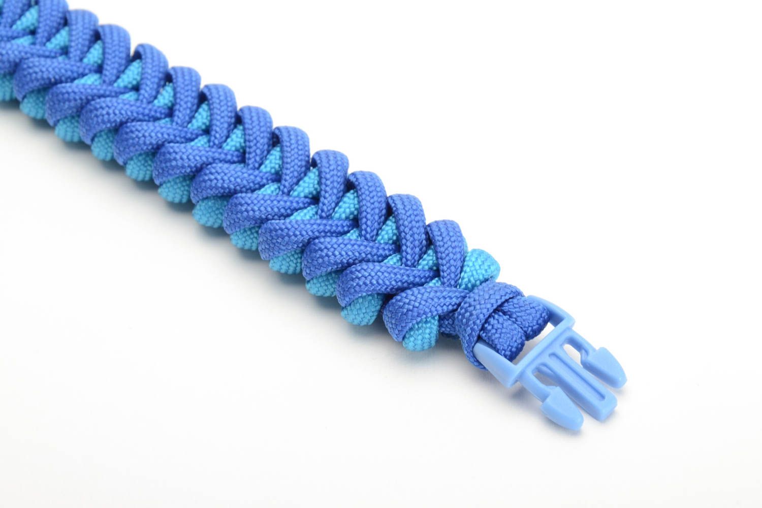 Handmade wrist survival bracelet woven of blue parachute cord with plastic fastener photo 2