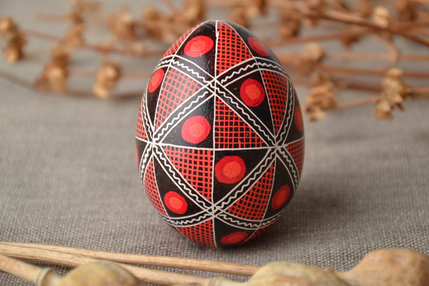 Painted Easter egg with ornament decorated using wax technique photo 1