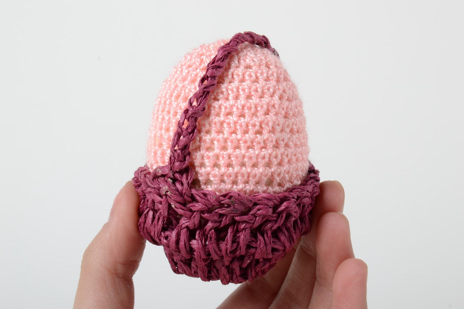 Handmade decorative crochet Easter egg of pink color in basket photo 5