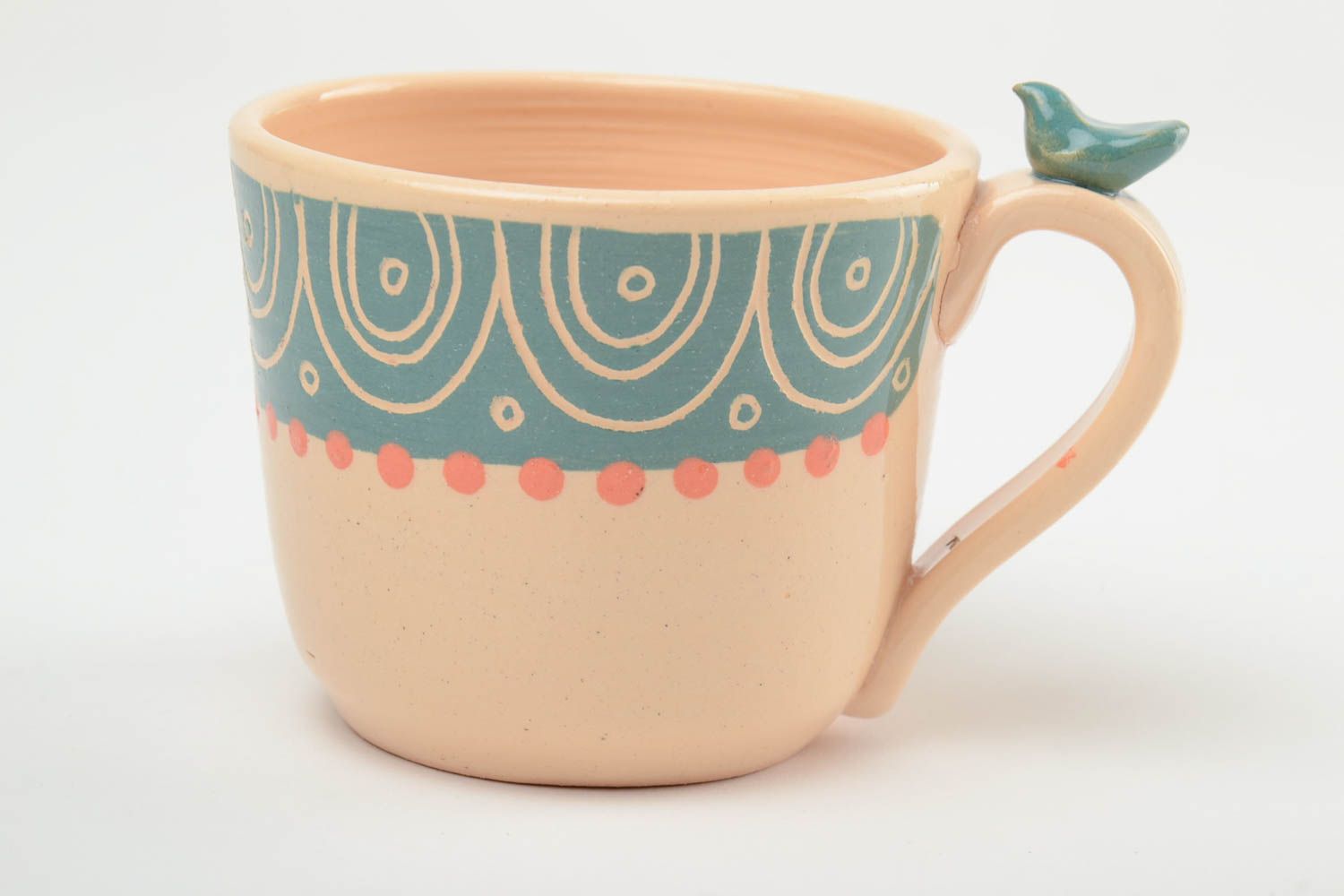 Glazed 11 oz ceramic cup of peach color with a bird on the handle photo 3