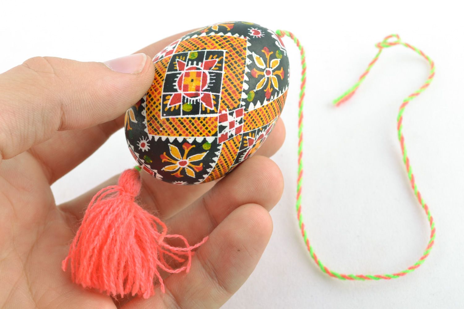 Handmade hanging Easter egg painted with hot wax and decorated with tassel  photo 2