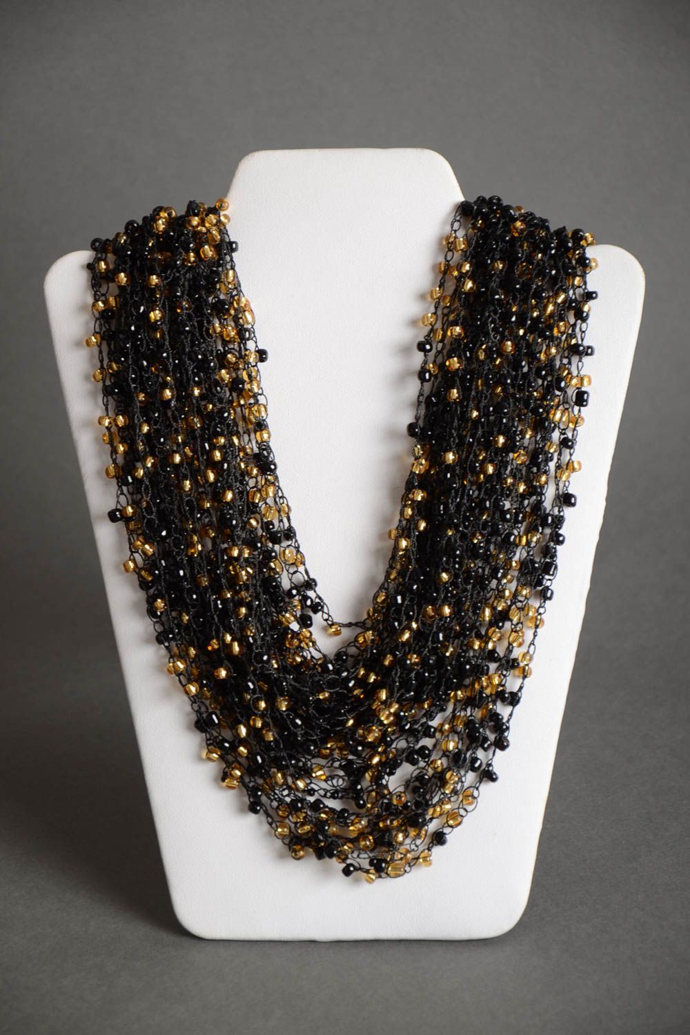 Handmade long massive necklace crocheted of black and golden Czech beads photo 2