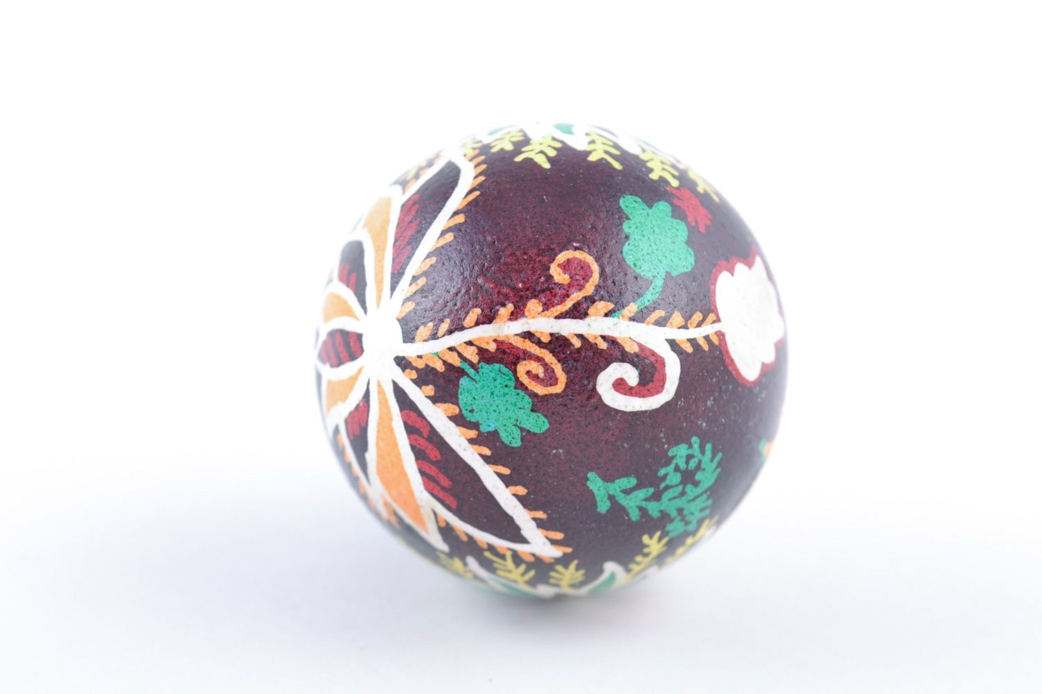 Handmade designer painted Easter egg with floral ornaments on dark background photo 5