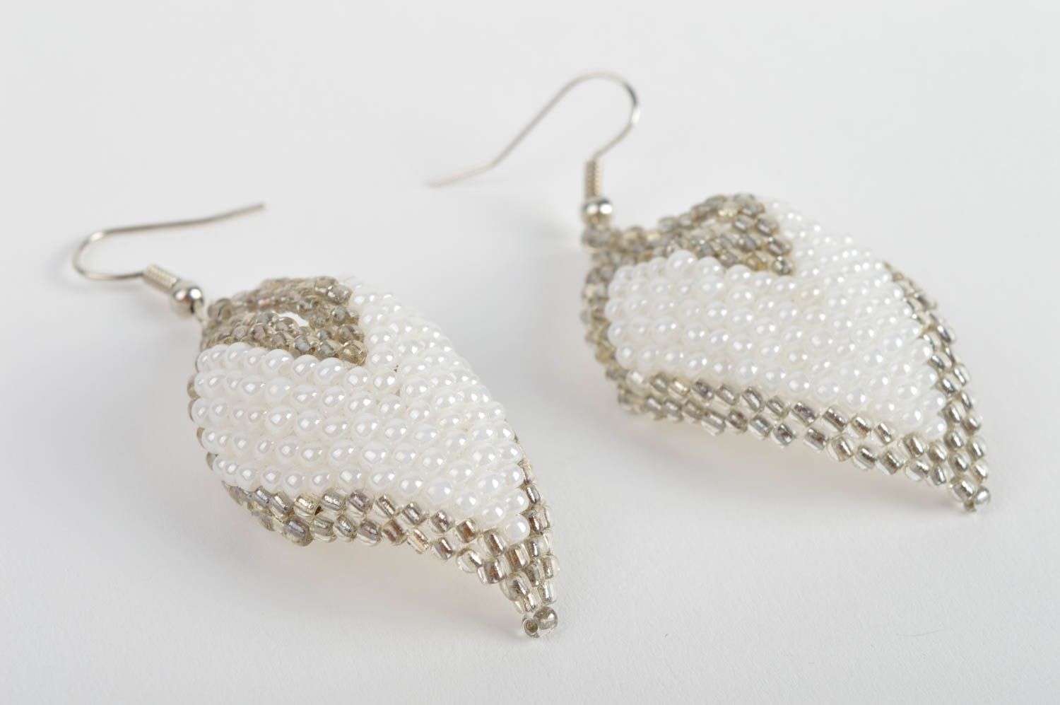 Handmade white and gray beaded woven dangle earrings in the shape of leaves photo 3
