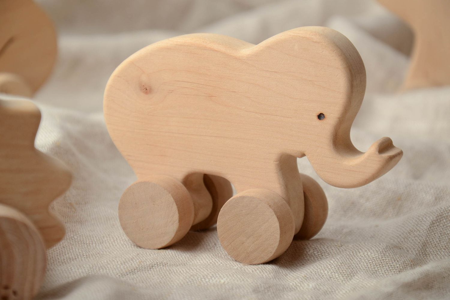 Children's wooden wheeled toy elephant photo 1