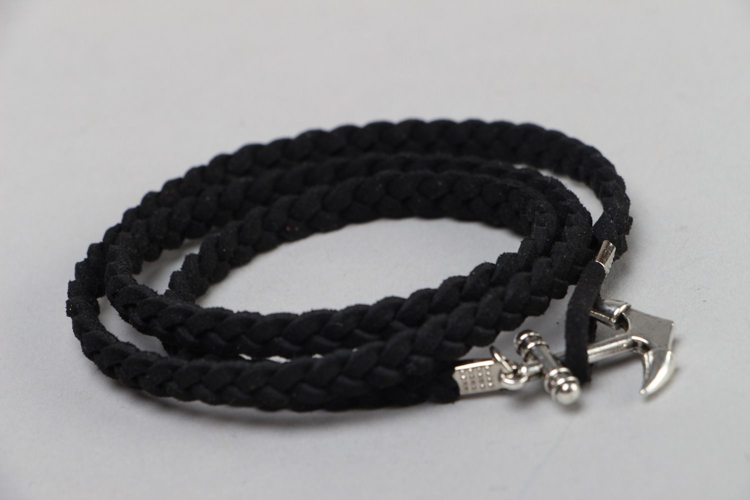Handmade friendship bracelet woven of faux suede cord of black color with anchor photo 1