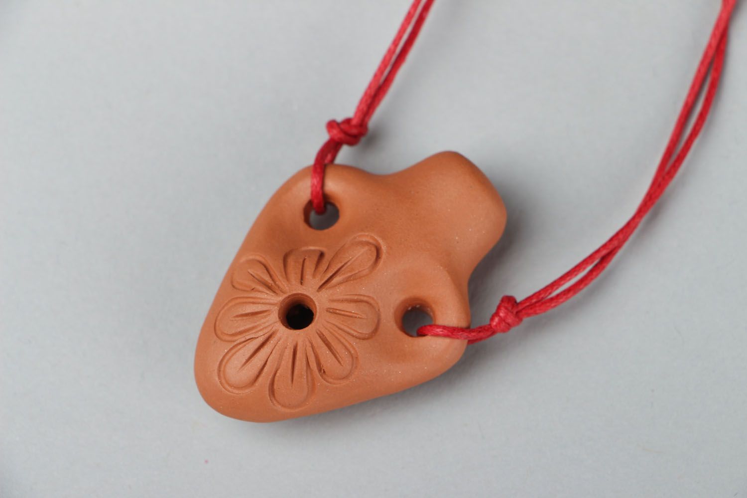 Clay penny whistle in the shape of amphora photo 1