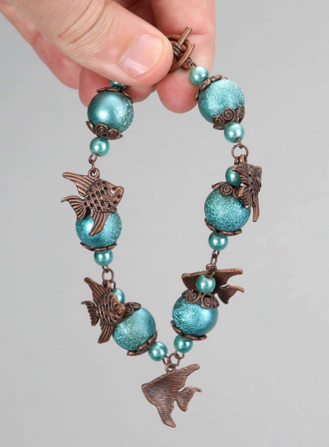 Ceramic pearls bracelet with fishes photo 3