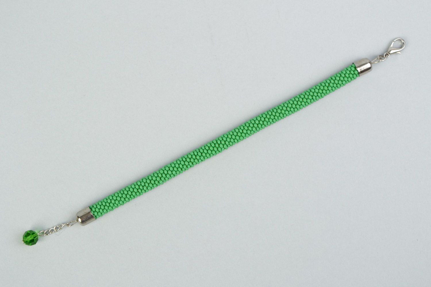 Beautiful handmade tender green beaded cord women's wrist bracelet with charm photo 5