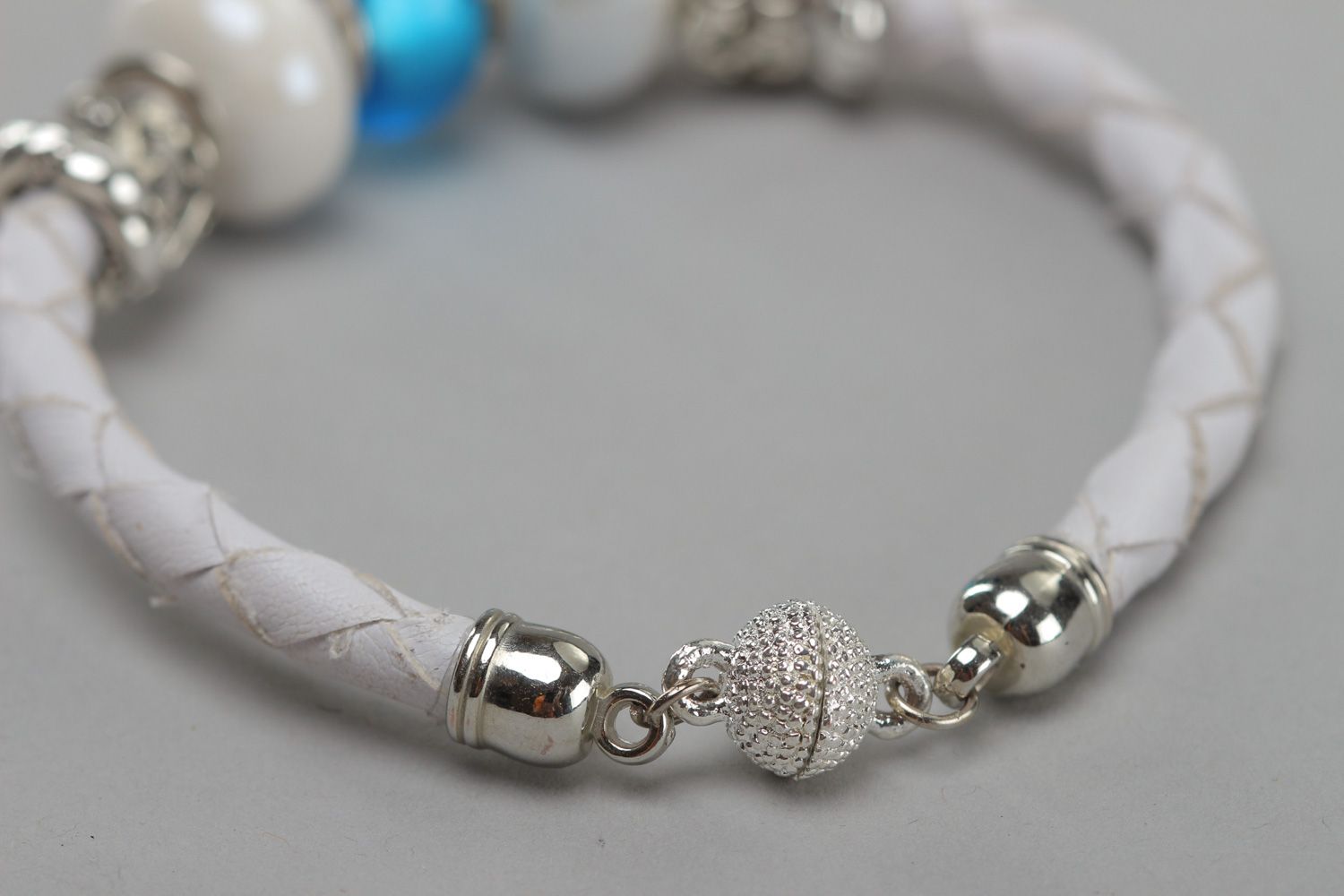 Tender handmade wrist bracelet woven of white faux leather with beads for women photo 4