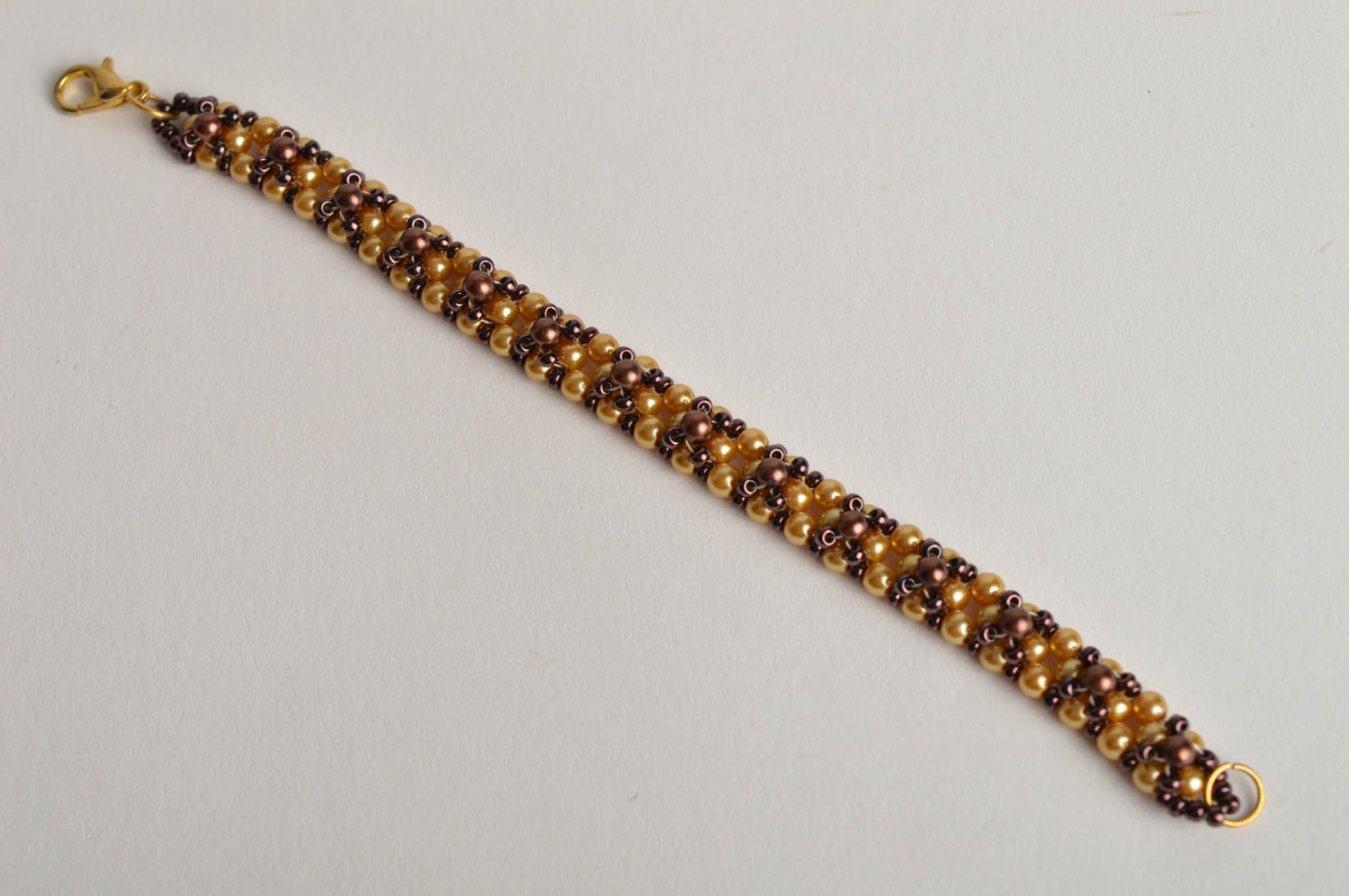 Handmade beaded bracelet in golden and brown color for girls photo 2