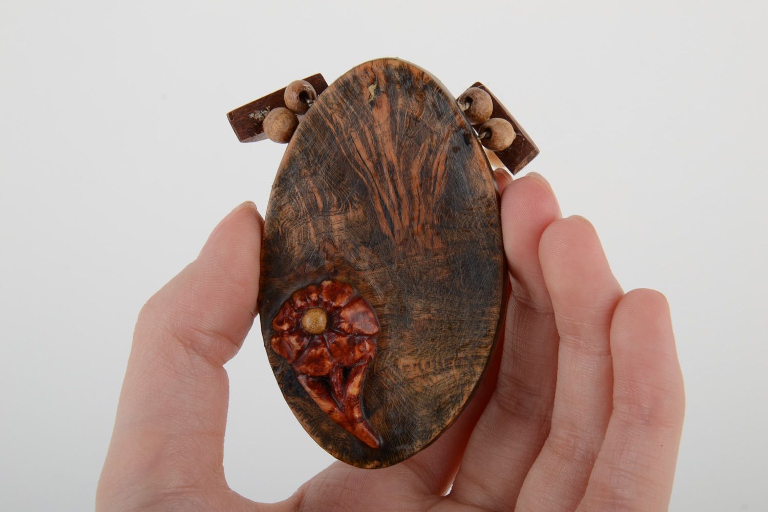 Handmade dark tinted wooden neck pendant of oval shape with flower for women photo 5