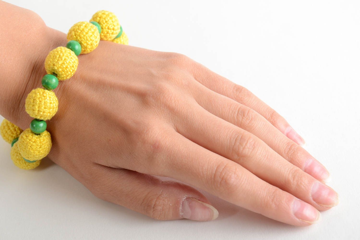 Yellow and green handmade designer crocheted ball bracelet  photo 2