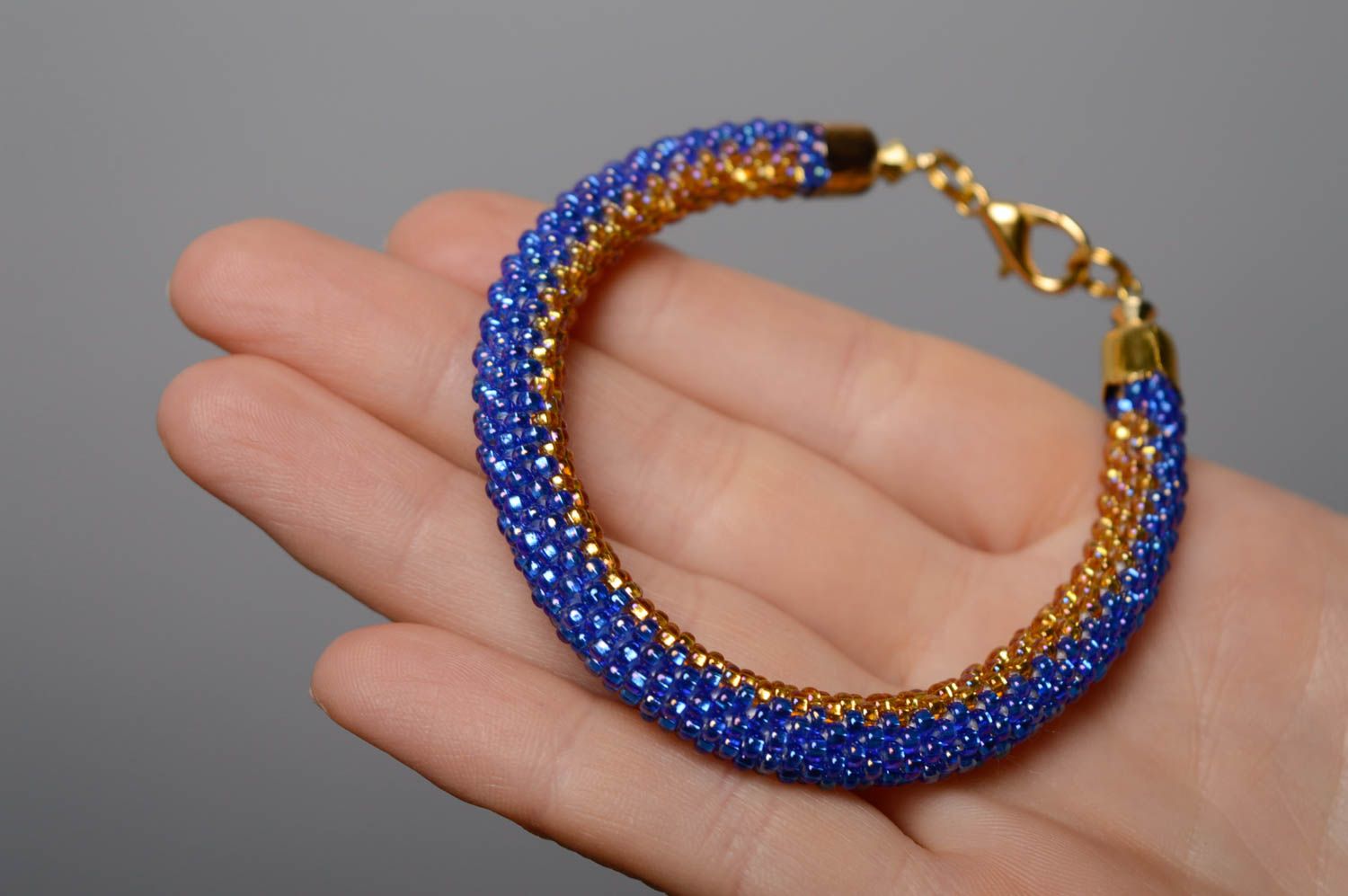 Handmade blue and gold color beads adjustable cord bracelet for women photo 4