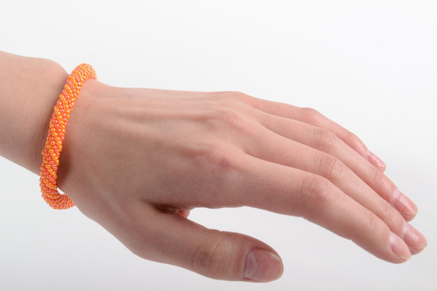 Handmade female bright beautiful designer beaded cord bracelet in orange color photo 5