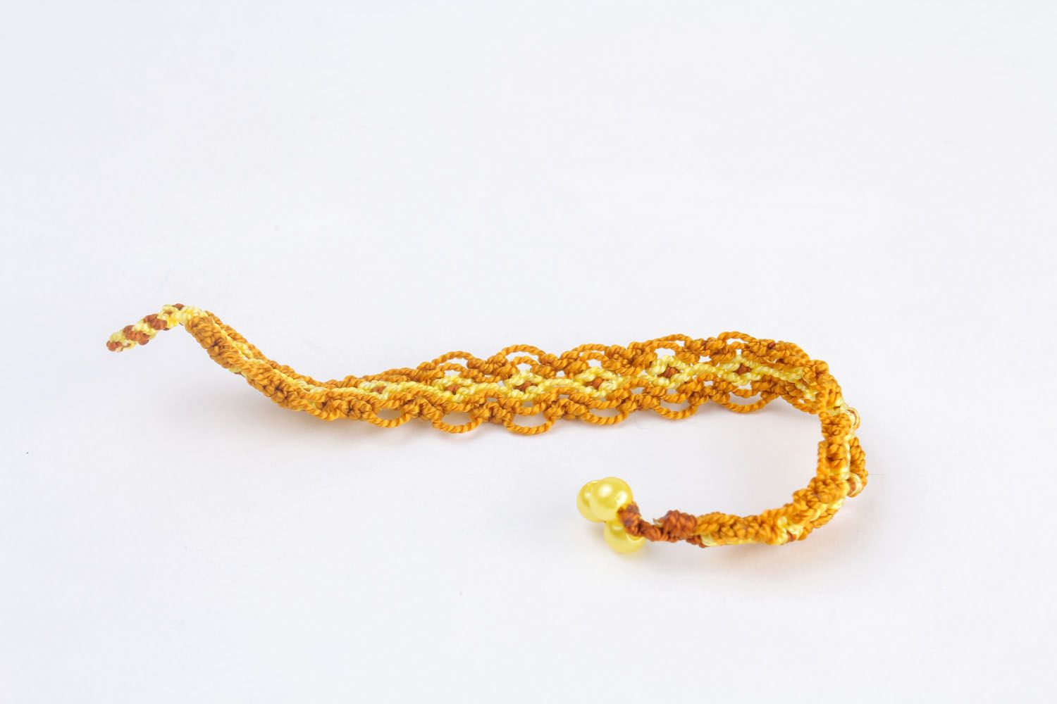 Yellow bracelet made using macrame weaving technique photo 5