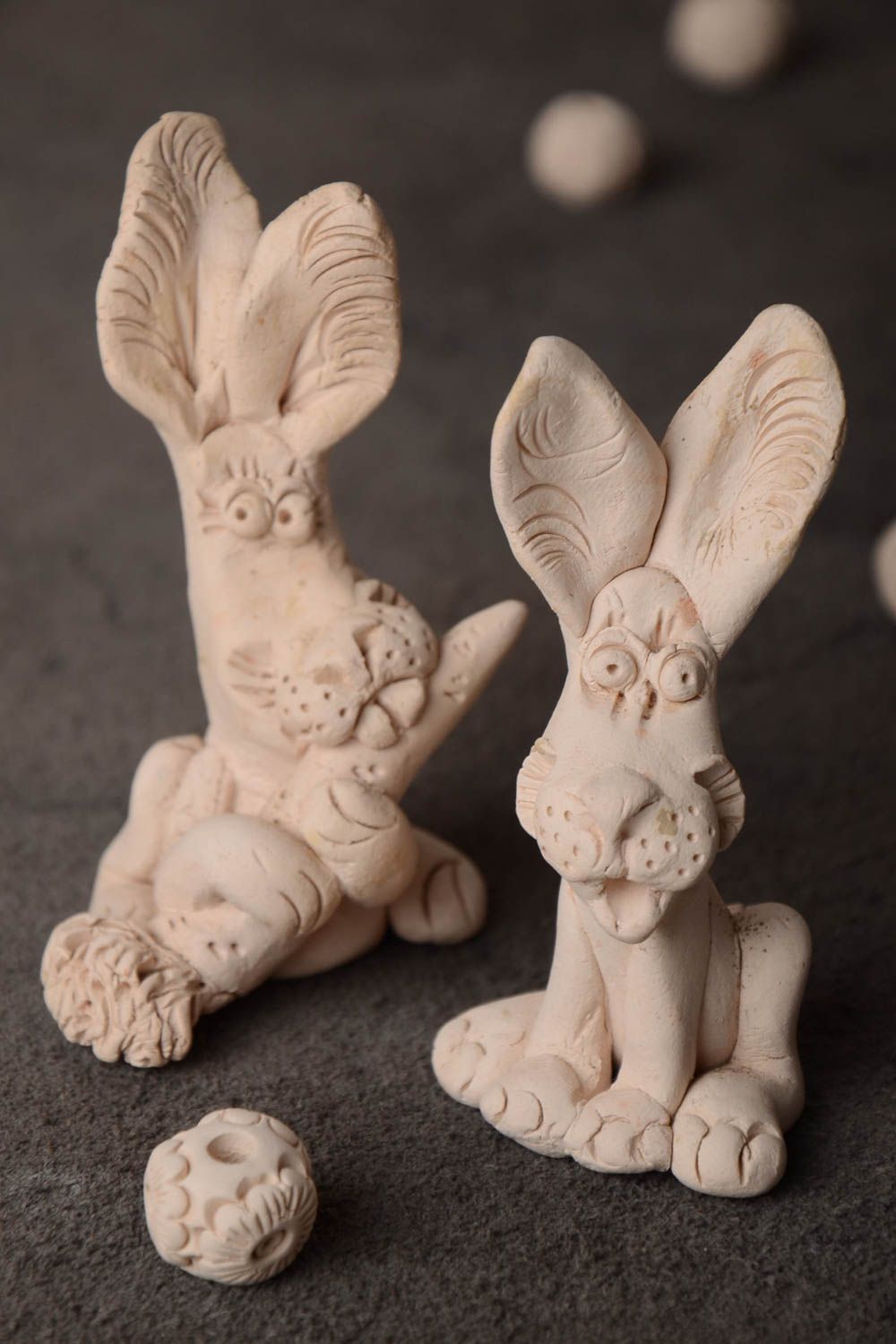 Set of 2 handmade funny miniature ceramic figurines of rabbits for interior photo 1
