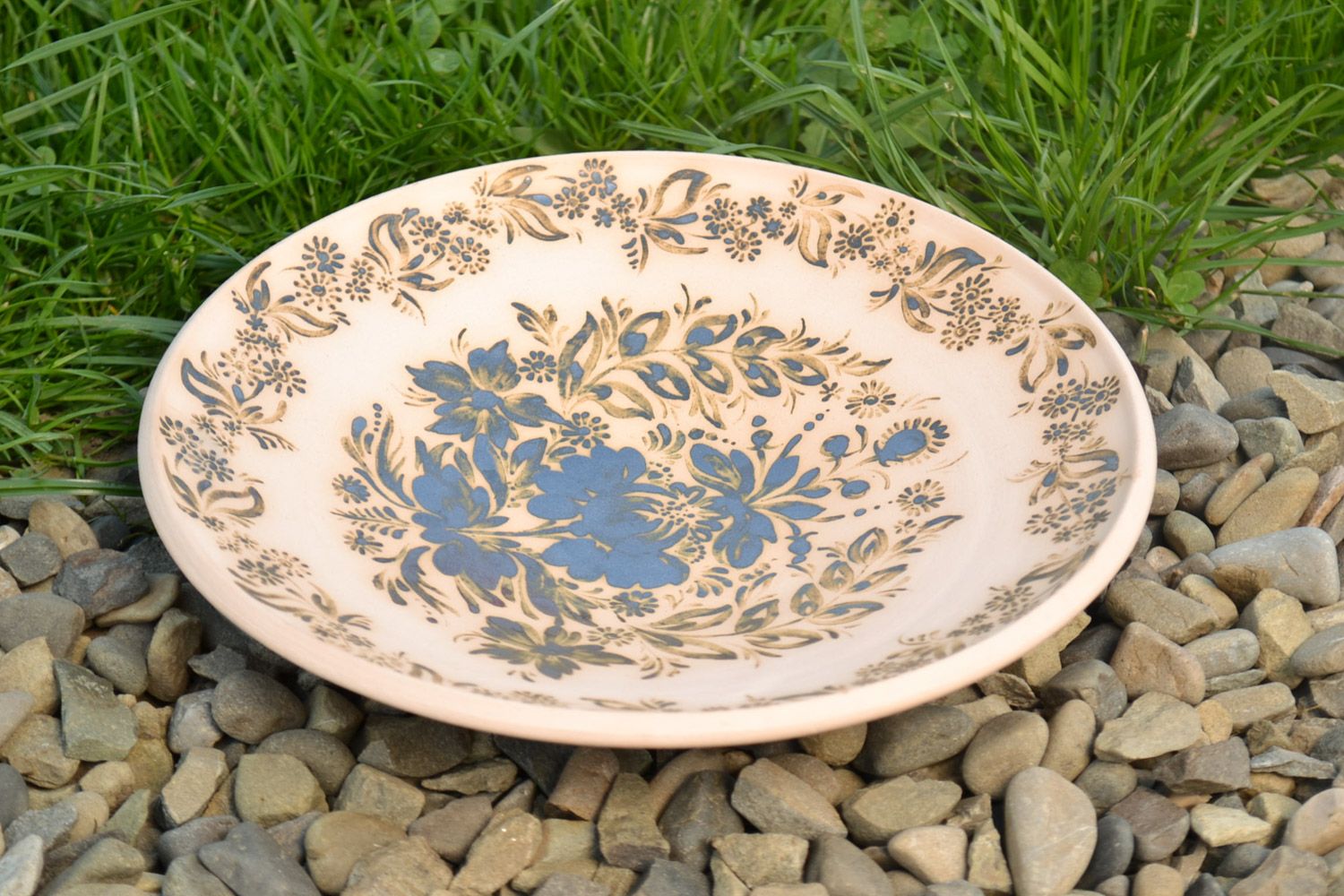 Handmade decorative ornamented light ceramic plate painted with glaze photo 1