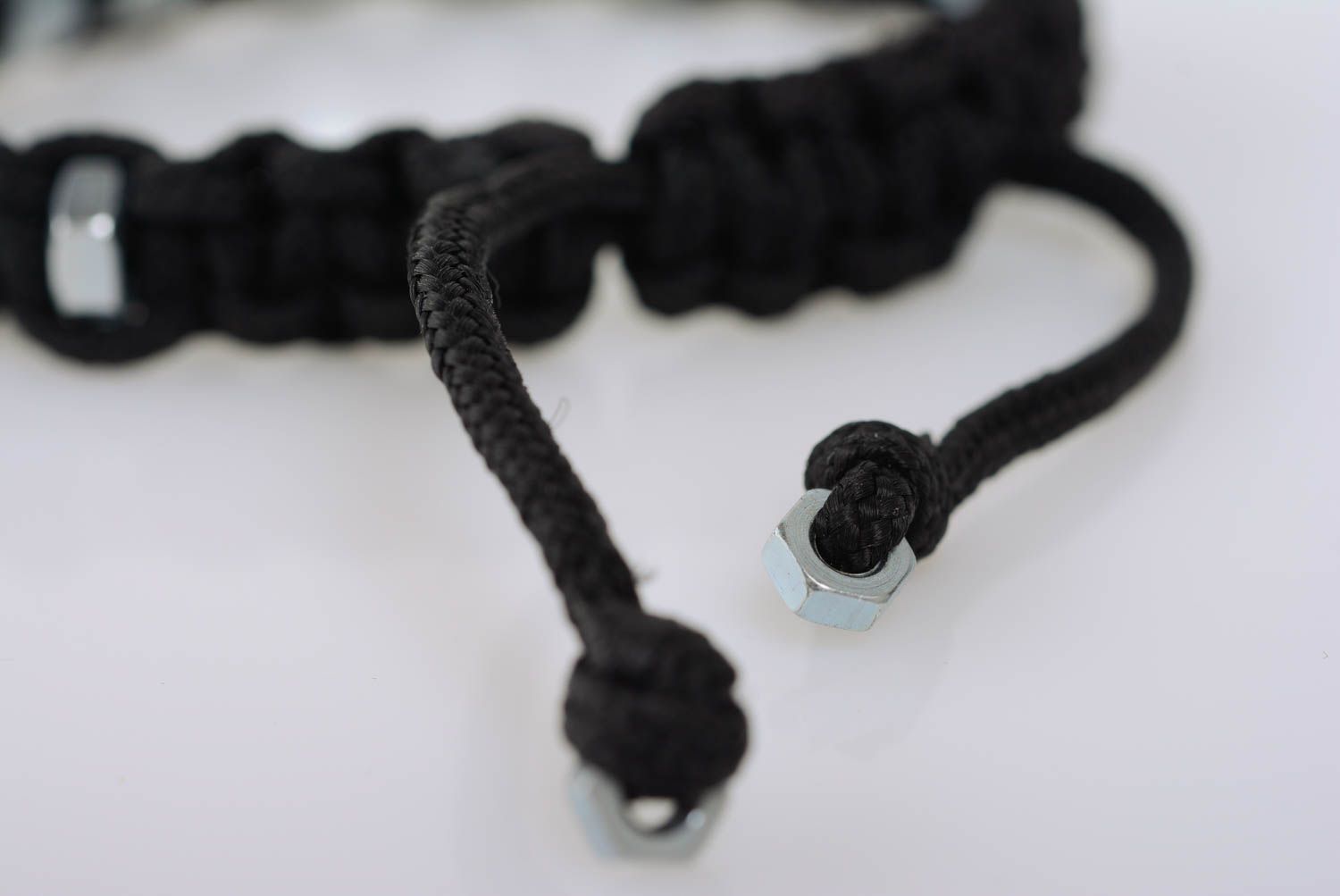 Black handmade designer woven cord bracelet with corrosion resistant nuts photo 5