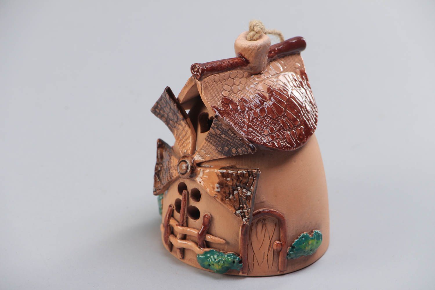 Multi-colored handmade designer ceramic bell in the shape of house of average size for home decor photo 2