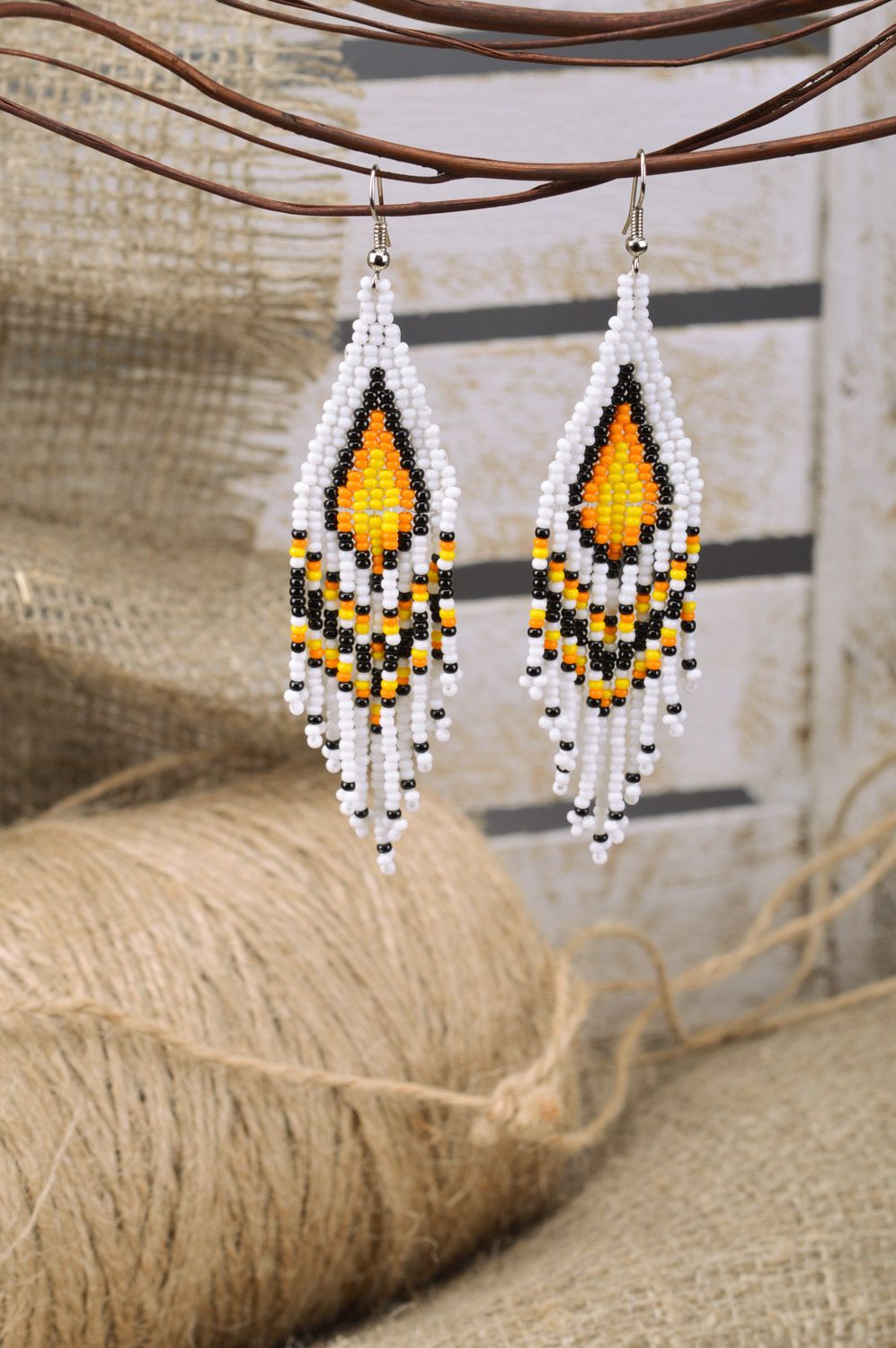 Unusual stylish light handmade earrings woven of Czech beads with fringe photo 1