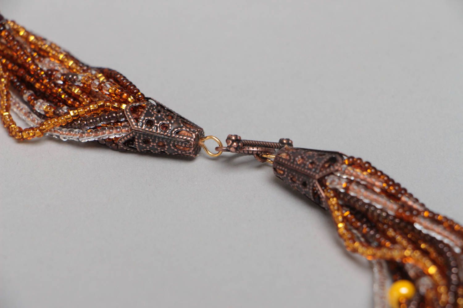 Handmade designer multi row beaded necklace in amber color palette for women photo 4