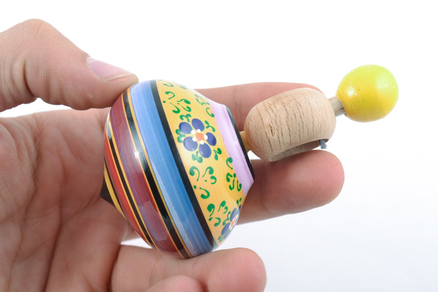 Маленький деревянный волчок ручной работы с росписью развивающая игрушка детская фото 2