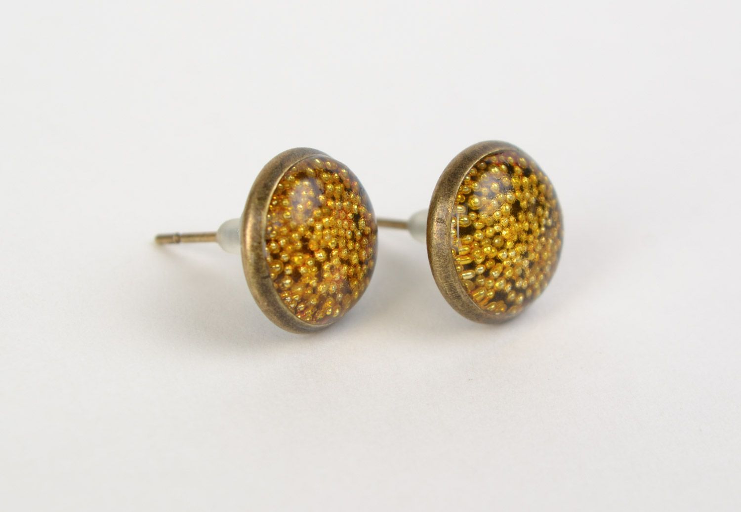 Yellow handmade round earrings with micro beads coated with jewelry resin photo 1