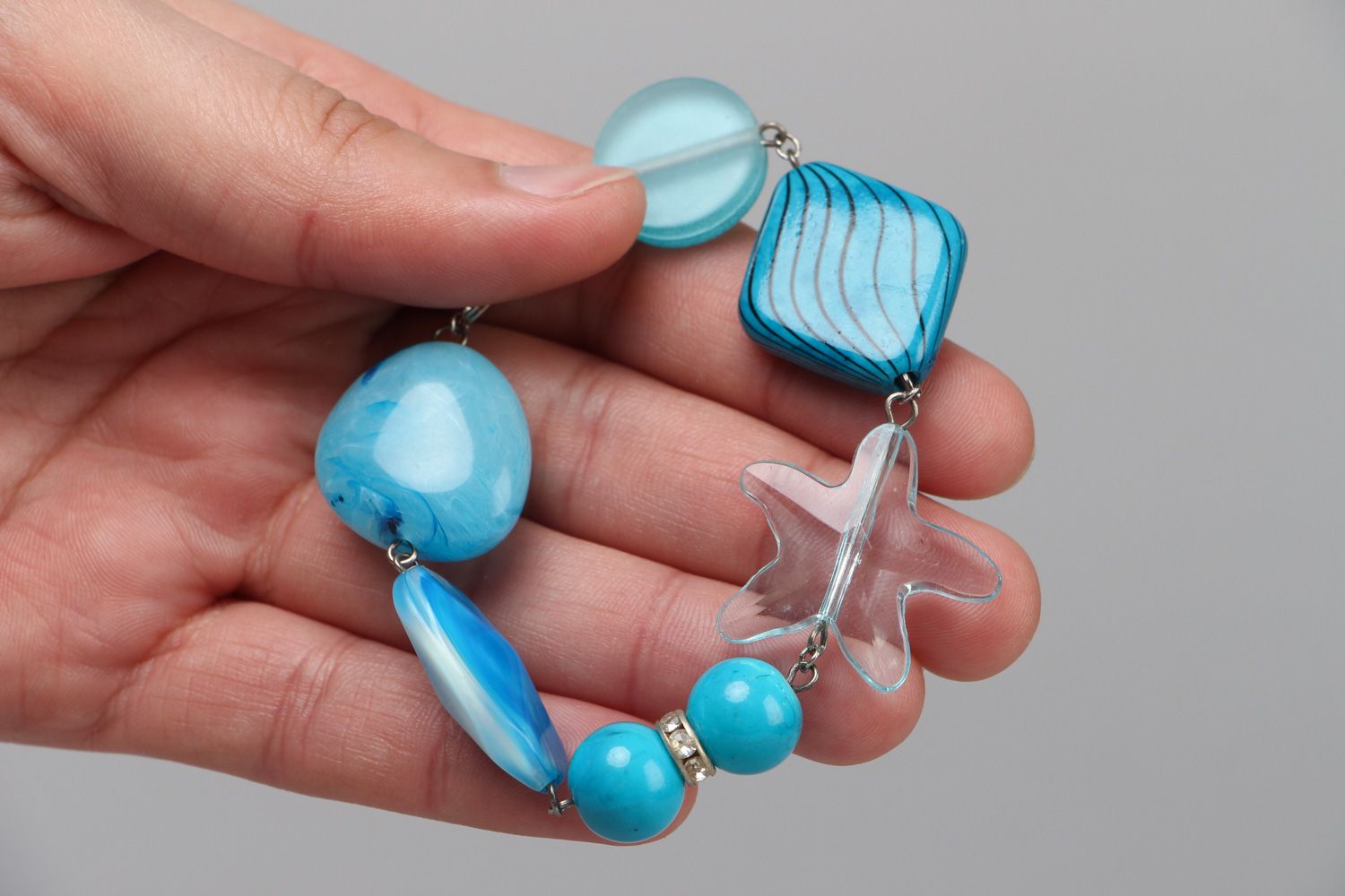Handmade light blue wrist bracelet with plastic beads in marine style for women photo 2