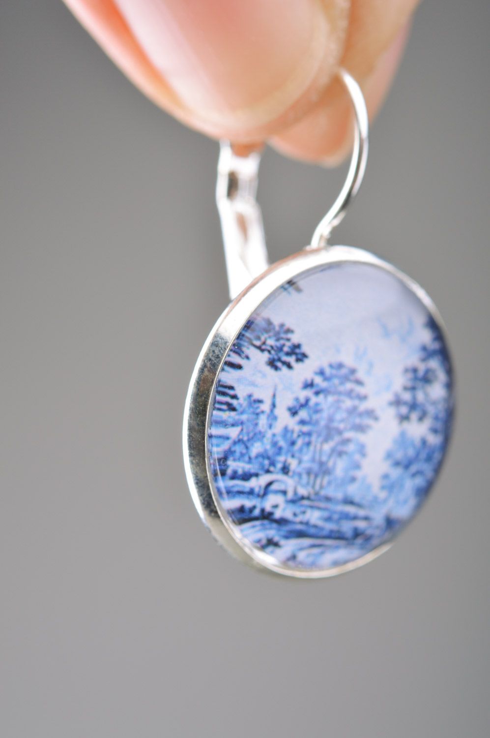 Handmade metal round dangle earrings with landscape print in white and blue colors photo 3
