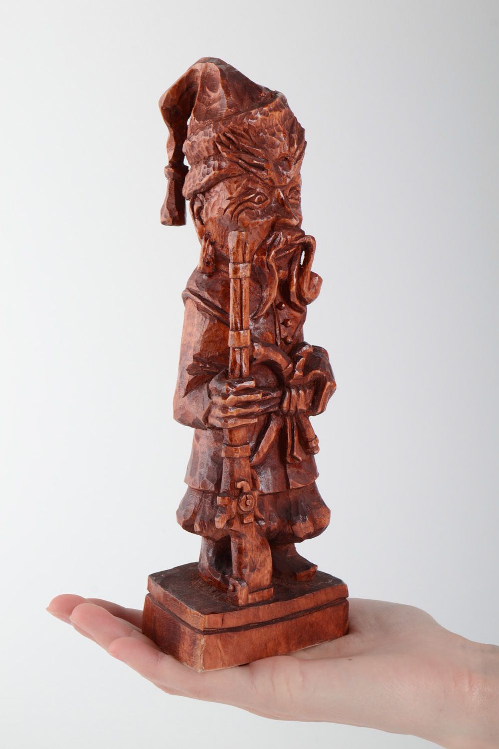 Handmade carved tinted wooden figurine coated with varnish for table decoration photo 5
