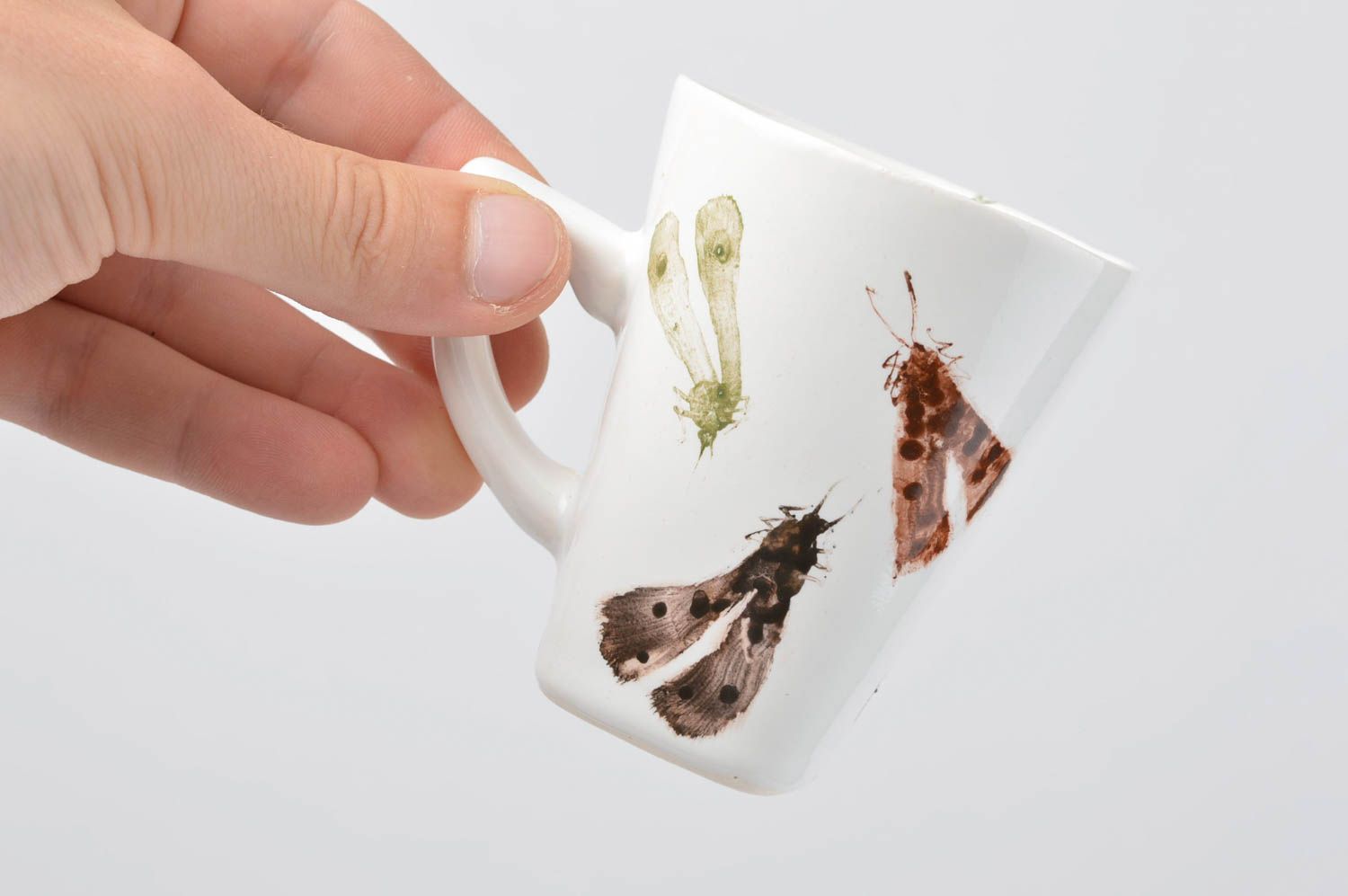 White ceramic teacup with handle and insects prints photo 5