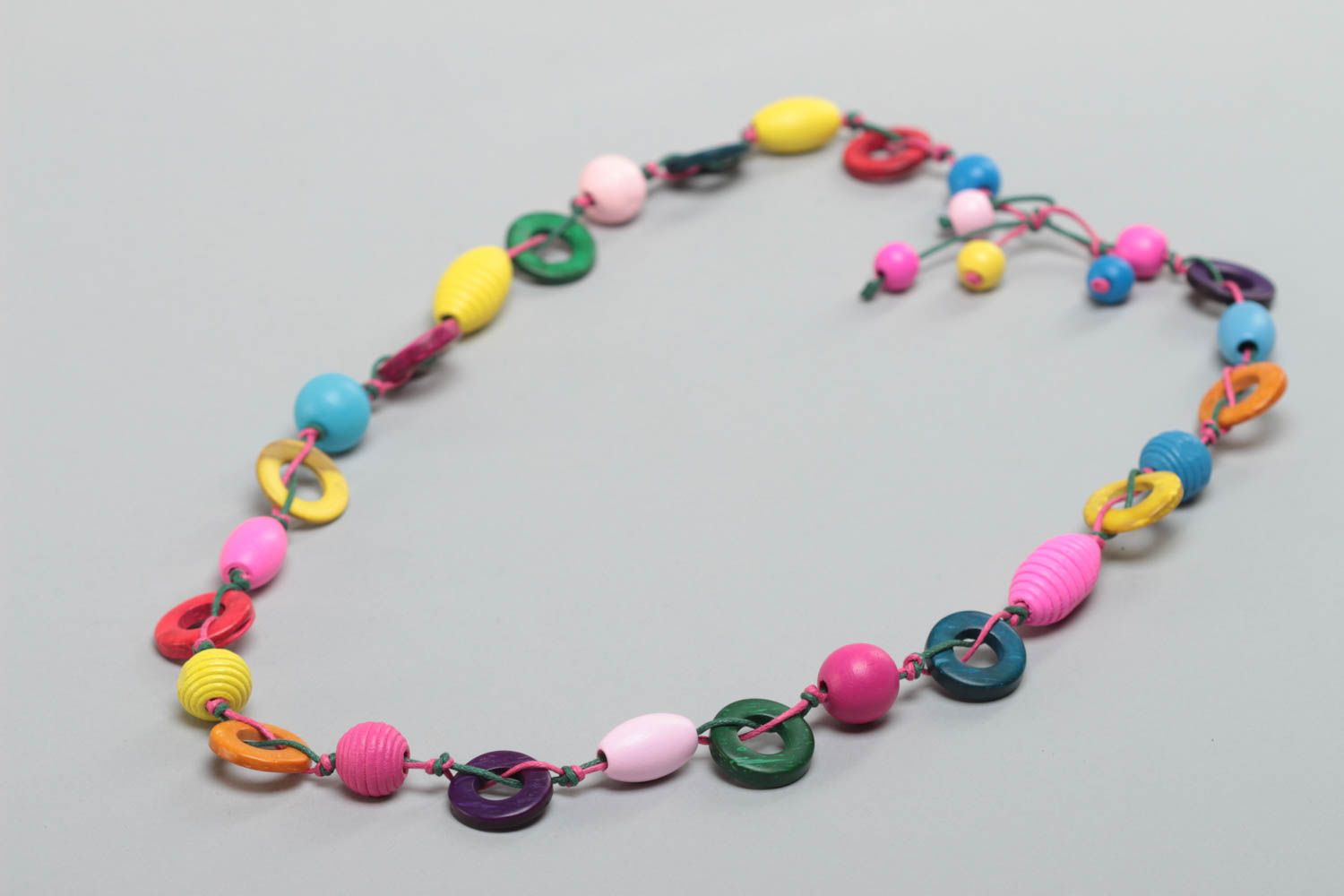 Beautiful bright necklace with wooden and coconut beads for children photo 2
