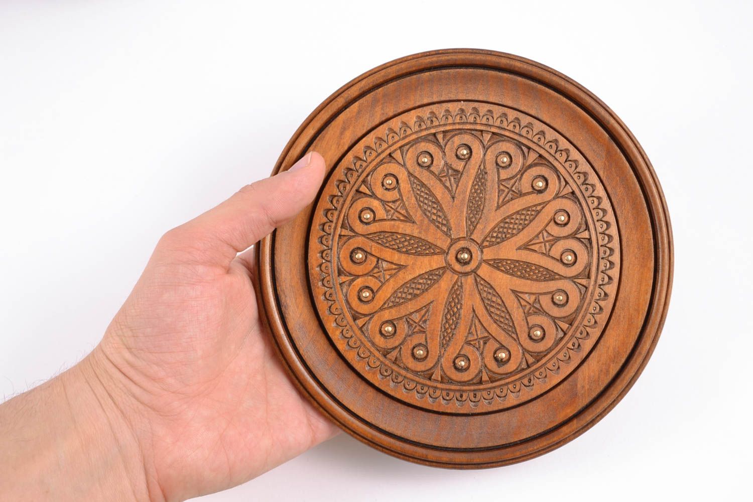 Carved wooden wall plate inlaid with metal inserts photo 2