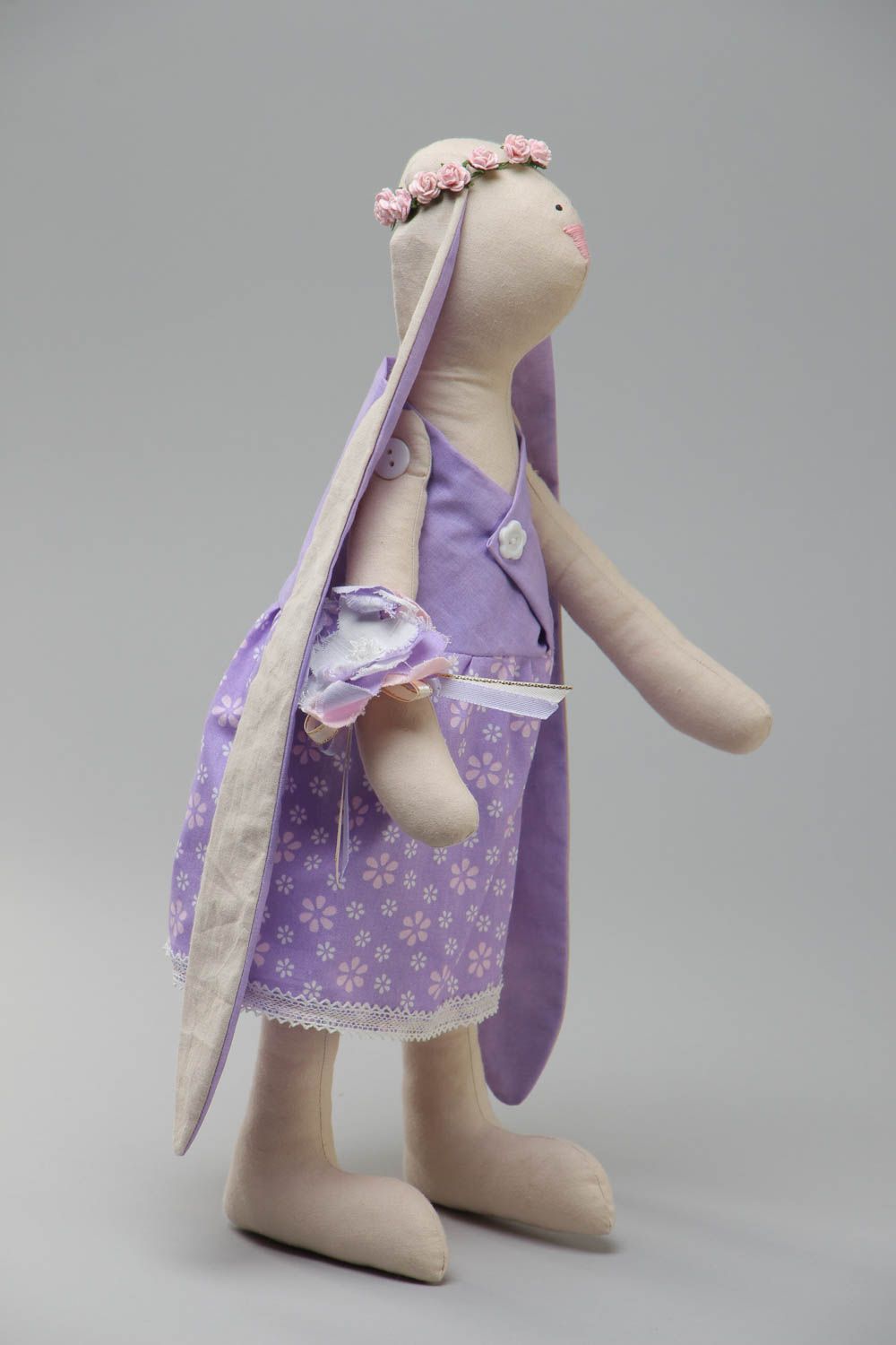 Handmade soft toy sewn of cotton fabric in the shape of rabbit with long ears photo 2